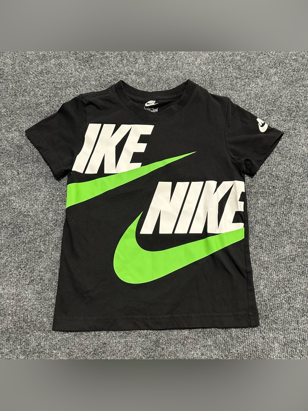 Nike Kids Futura Evergreen T-Shirt in black with a bright green and white